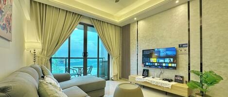 Comfort Apartment, 2 Bedrooms, Sea View | Living area | 55-inch flat-screen TV with cable channels, TV