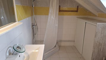 Shower, hair dryer, towels, toilet paper
