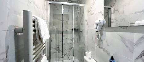 Shower, hair dryer, towels, soap