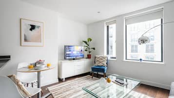Apartamento luxo, vista para a cidade | Área de estar