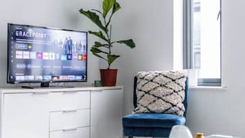 Apartamento luxo, vista para a cidade | Área de estar