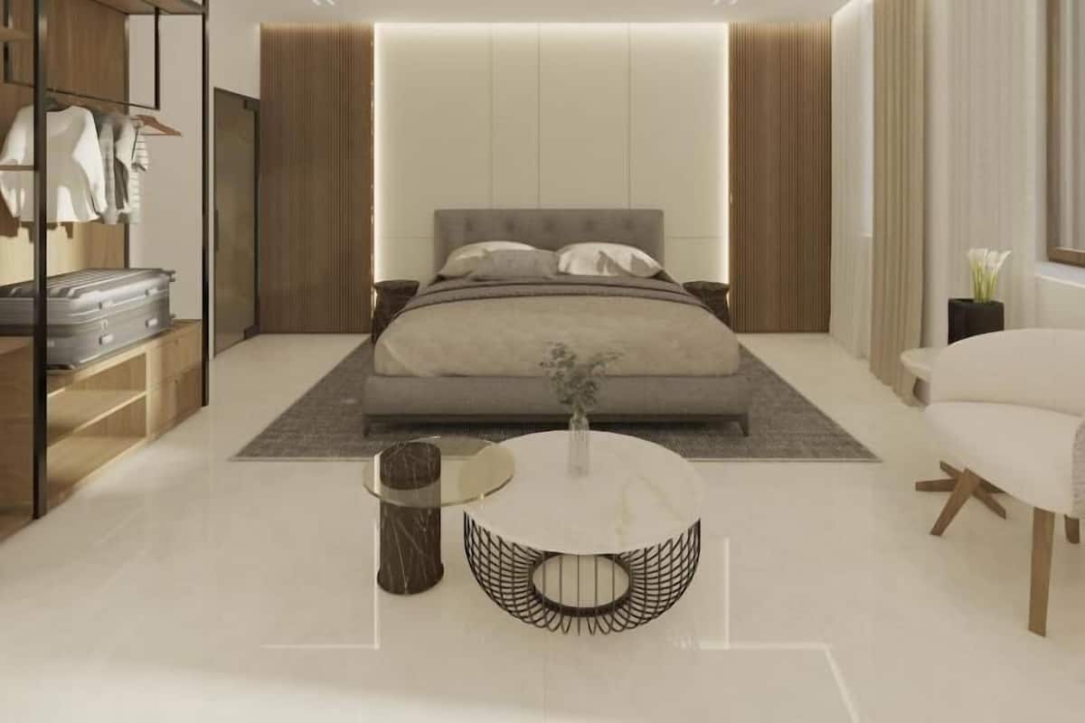 Un dormitorio moderno con cama, mesita de noche, silla y armario.
