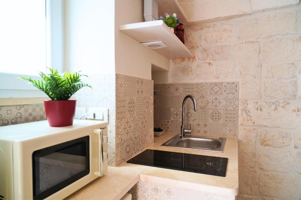 Comfort huis, uitzicht op de stad | Privékeuken | Een koelkast, een microgolfoven, een kookplaat, een kinderstoel