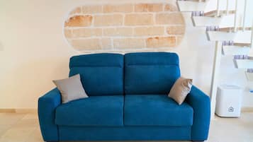 Comfort House, City View | Living area | Flat-screen TV