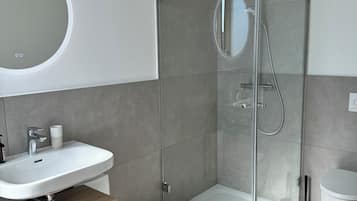 Shower, towels, soap, toilet paper