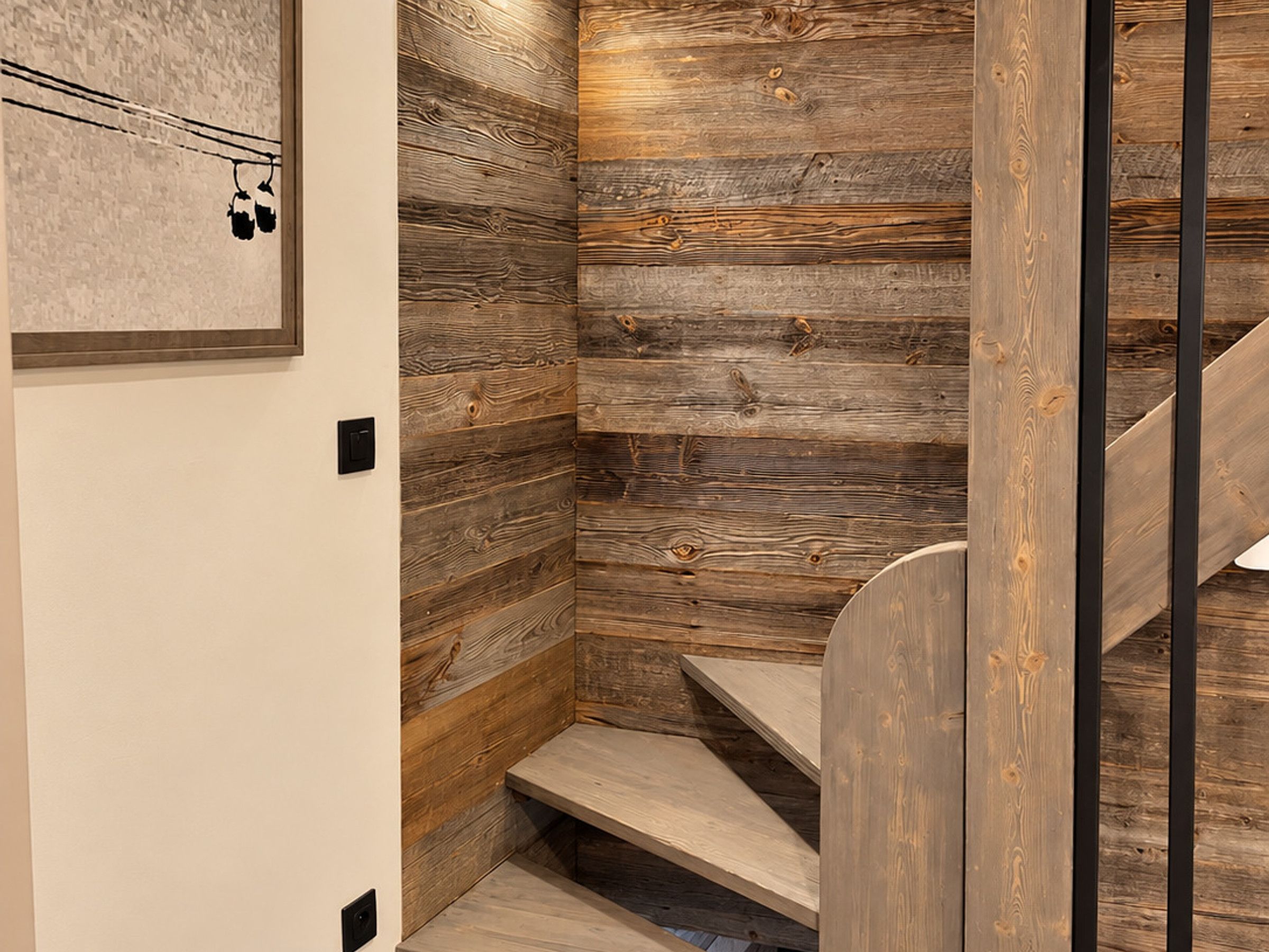 A staircase with wooden steps and a wall with a wood panel design.