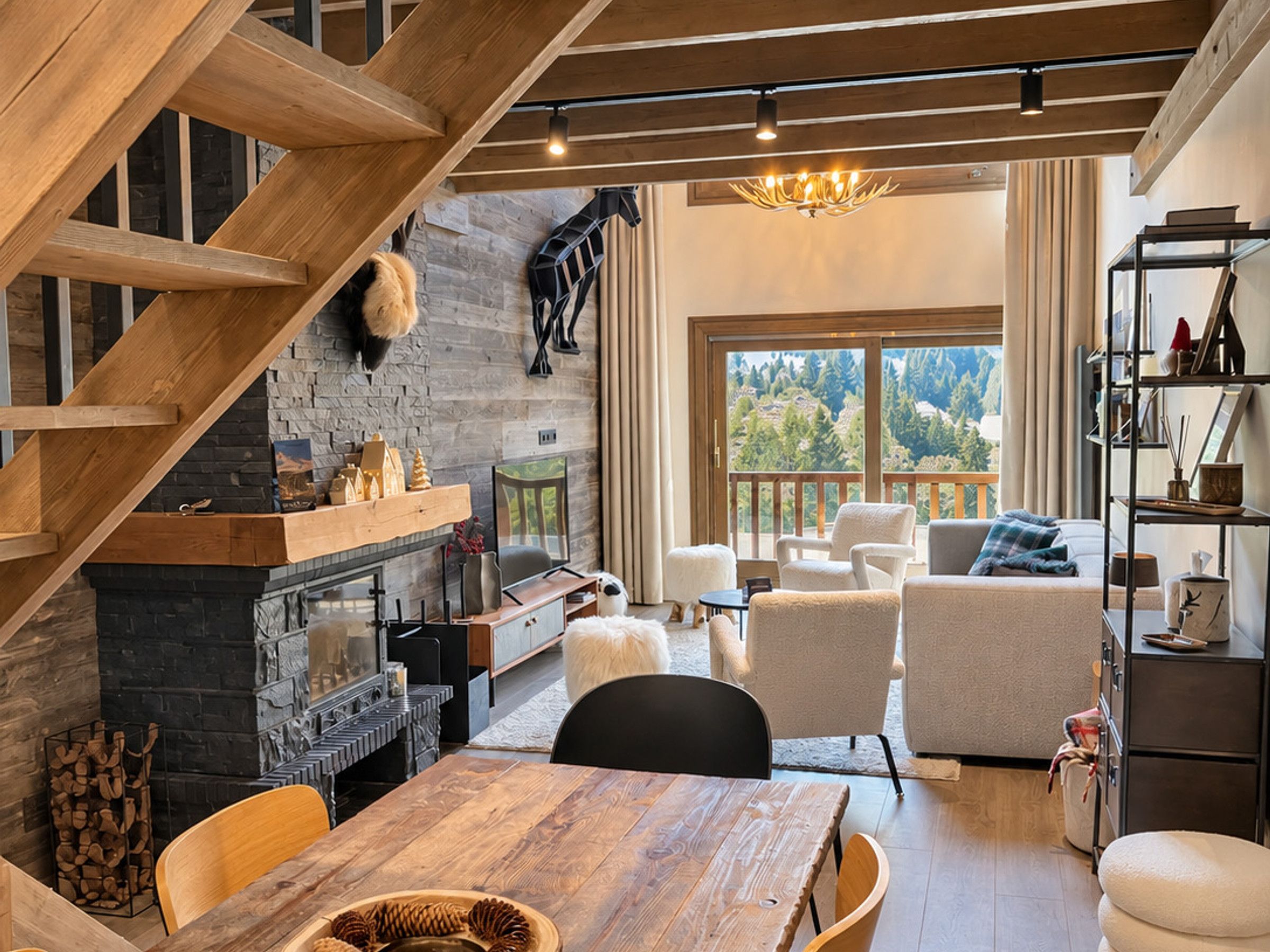 A cozy interior with a fireplace, wooden staircase, and a balcony with a view of trees.
