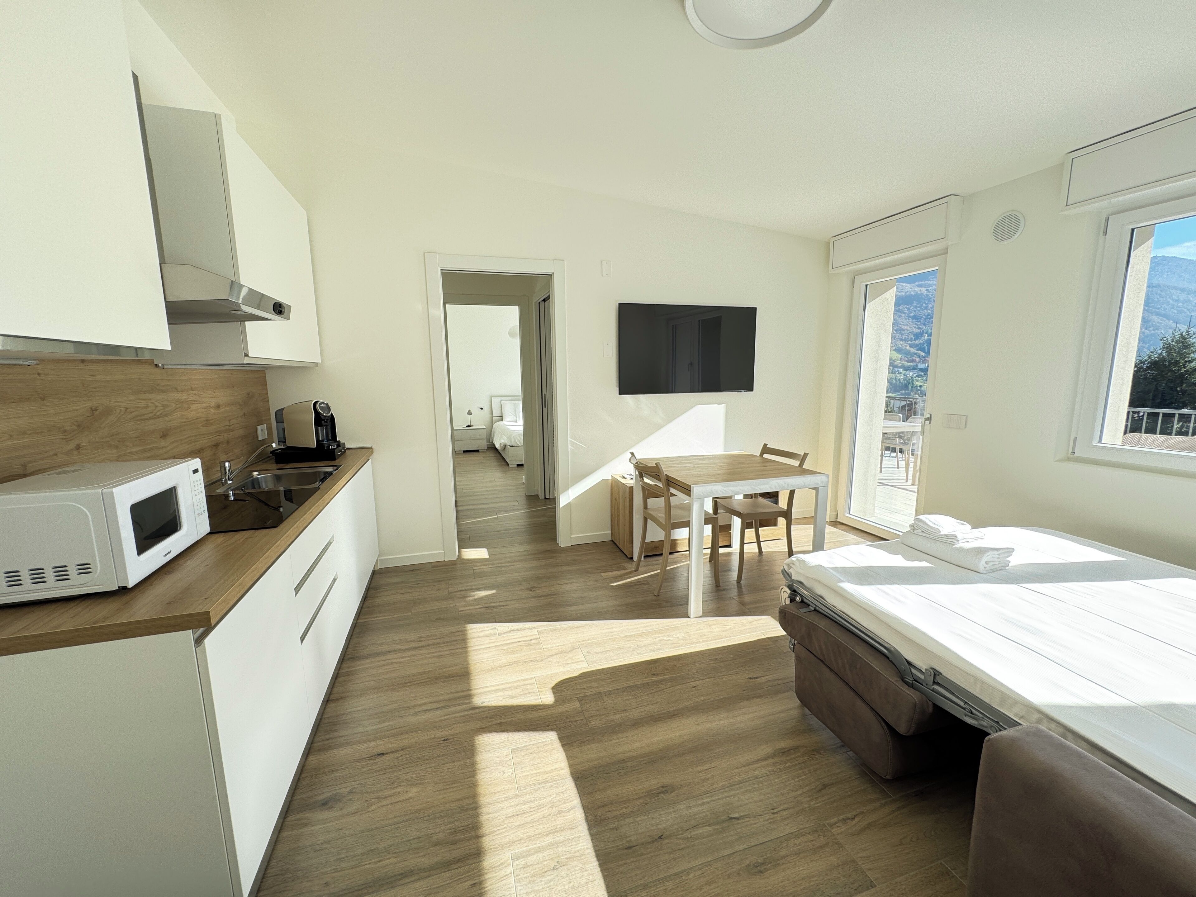 Appartamento Malga Lunga | Wohnbereich | 40-Zoll-Smart-TV mit Kabelempfang