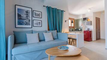 Deluxe Loft, Sea View | Living area | Flat-screen TV