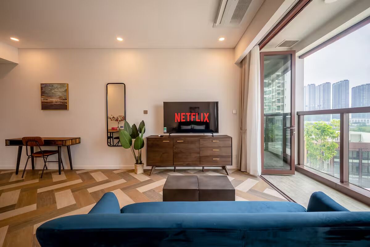 Luxury Apartment, 1 Bedroom, Balcony, City View | Living area | 55-inch Smart TV with digital channels