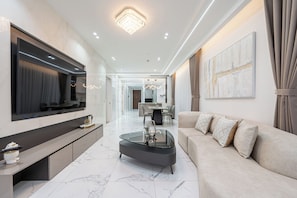 Premium Apartment, 4 Bedrooms, City View | Living area | 55-inch Smart TV with digital channels - Sunny The Galleria Metropole (ThuThiem)