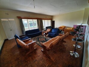 Family Villa, Garden View | Living area | 32-inch Smart TV with digital channels - Thayo Place (Nyeri County)