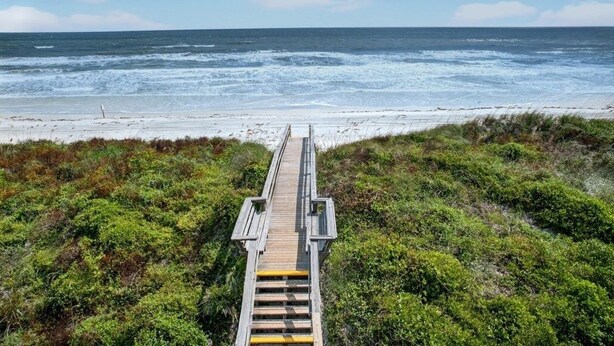 A wooden boardwalk leading to a beach with ocean views. - Quail Hollow A8-1u 2 Bedroom Condo (St. Augustine)