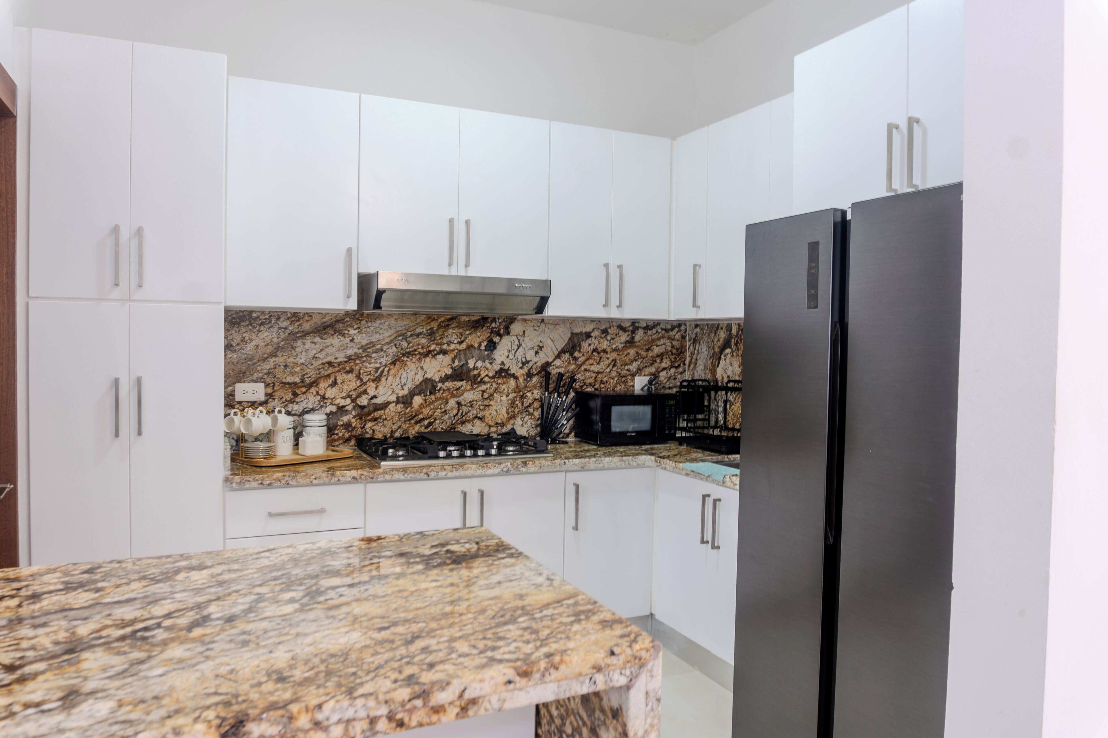 Fridge, microwave, stovetop, coffee/tea maker