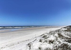 A beach with a sandy shore and dunes. - Summerhouse 218 2 Bedroom Condo (St. Augustine)