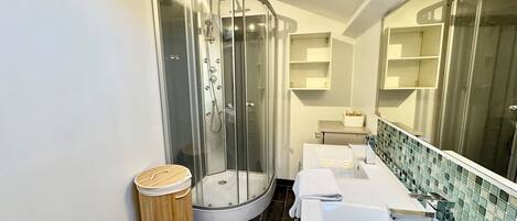 Shower, hair dryer, towels, soap