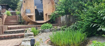 Cottage in Green Surroundings with Fireplace, Barrel Sauna and Mountain Views