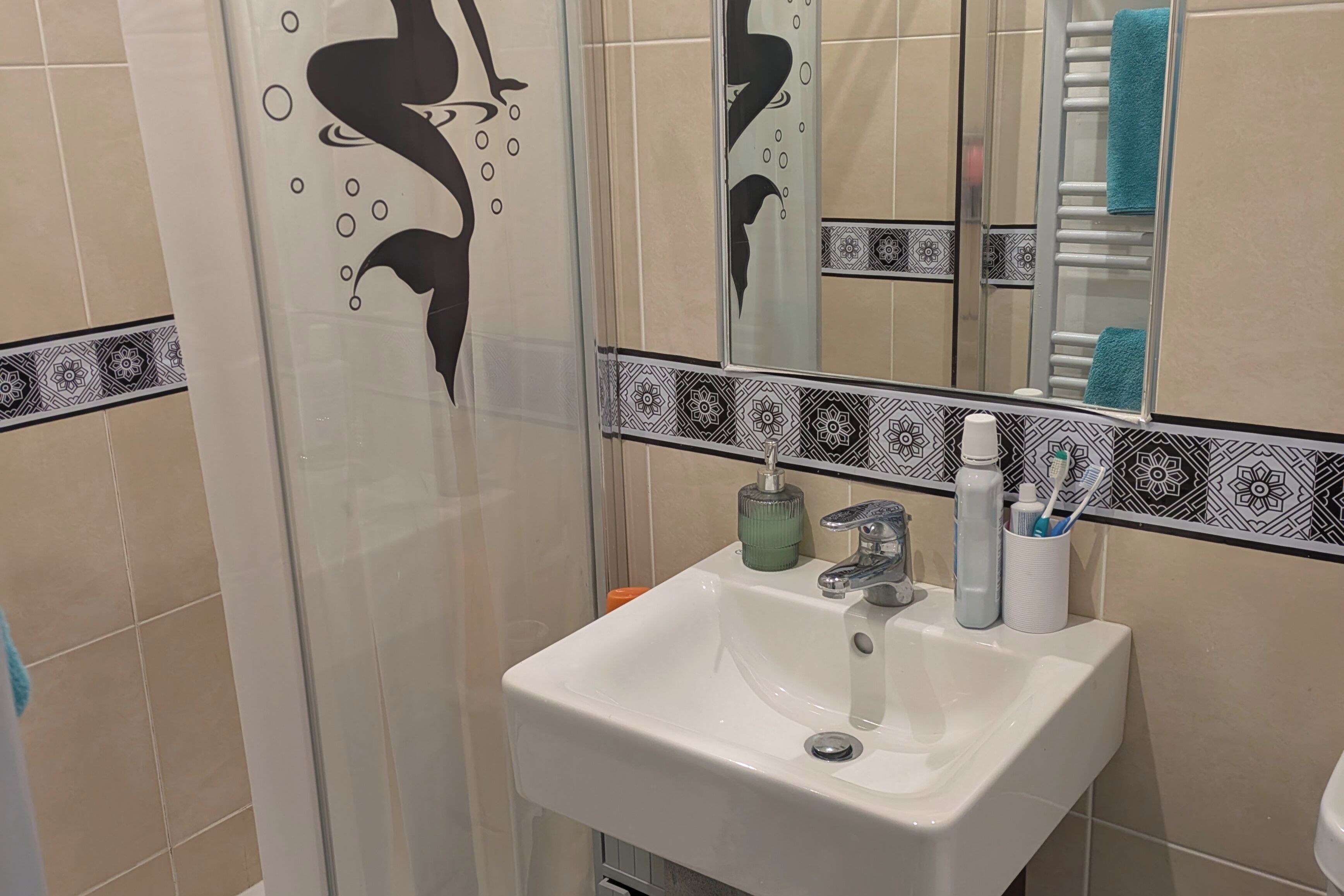 Separate bathtub and shower, deep-soaking bathtub, hair dryer, towels