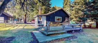 Moccasin Lake is a pet-friendly riverfront cabin on Wallowa Lake, large yard, sleeps 6