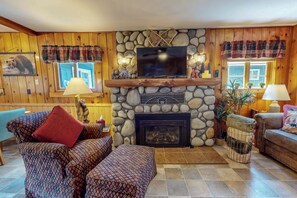 Smart TV, fireplace - Moccasin Lake is a pet-friendly riverfront cabin on Wallowa Lake, large yard, sleeps 6 (Joseph)