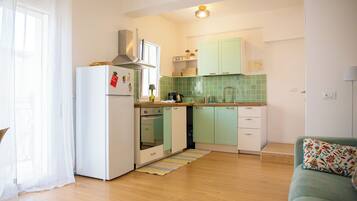 Apartment, eingeschränkter Meerblick | Eigene Küche