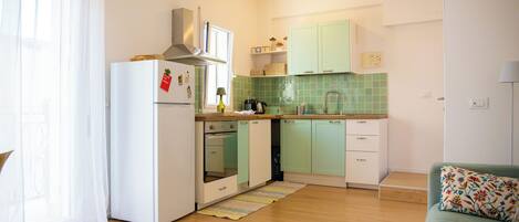 Apartment, eingeschränkter Meerblick | Eigene Küche