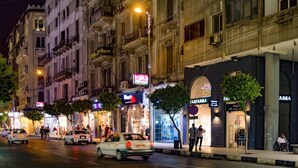 A street scene with buildings, shops, and cars. - Yacoubian Hotels (Cairo)
