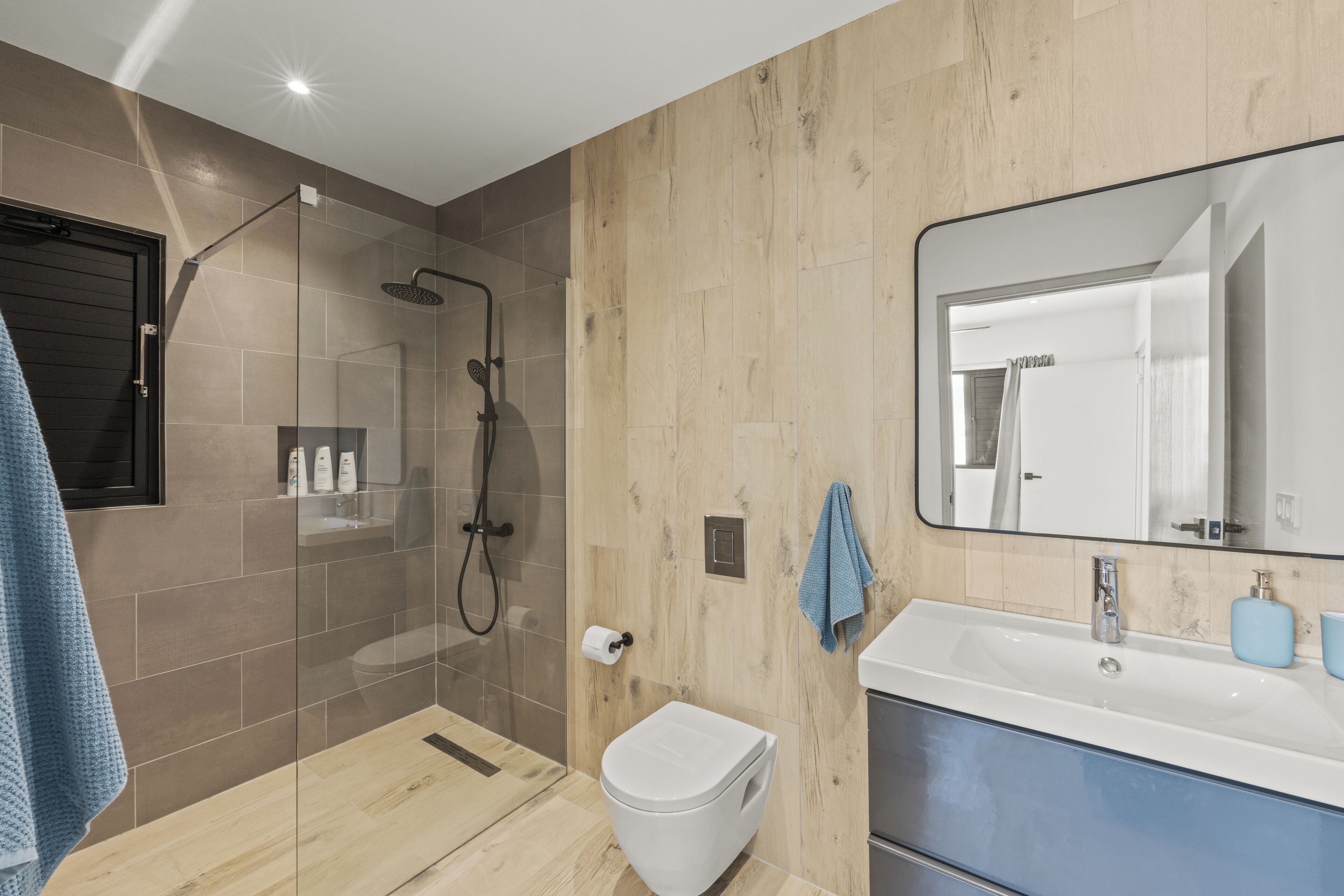 Shower, hair dryer, towels, soap