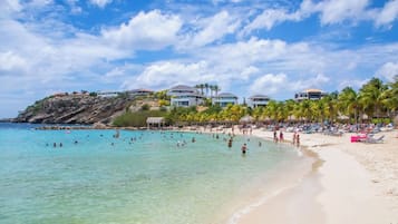 On the beach, sun-loungers, beach towels