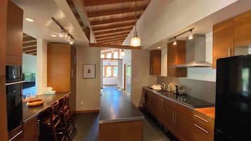 Fridge, dishwasher, coffee/tea maker, cookware/dishes/utensils