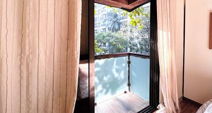 1BHK Balcony Retreat - Gulmohar Road, Juhu Beach, Mumbai