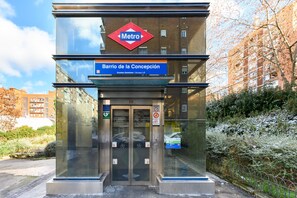 A Metro station entrance with a sign for 'Barrio de la Concepción' and an elevator. - (LCE3) Spacious and modern 4 bedroom apartment (Madrid)