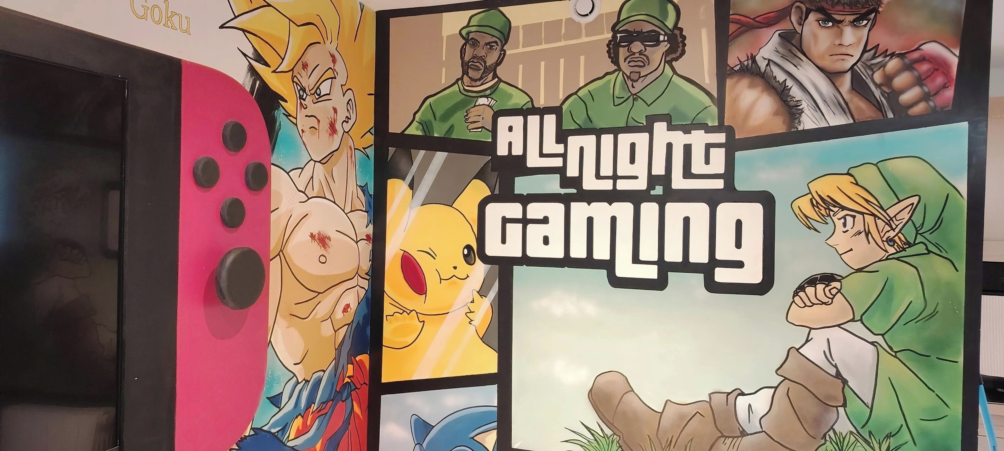 A wall with various gaming characters and the text "All Night Gaming".