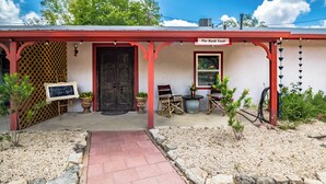 A building with a red exterior and a sign reading "The Bank Vault." - The Bank Vault Casita Stay at Downright Comfort (Comfort)