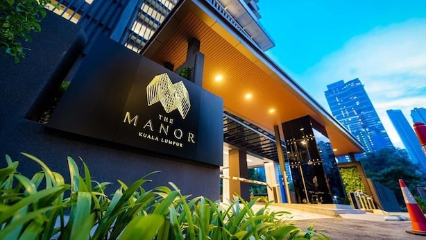 A modern hotel entrance with a prominent sign reading "The Manor Kuala Lumpur." - The Manor by Panorama Suite (Kuala Lumpur)