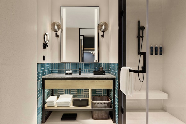 A modern bathroom with a wooden vanity, a large mirror, and a glass shower enclosure. - Four Points By Sheraton Hefei High-Tech Zone (Hefei)