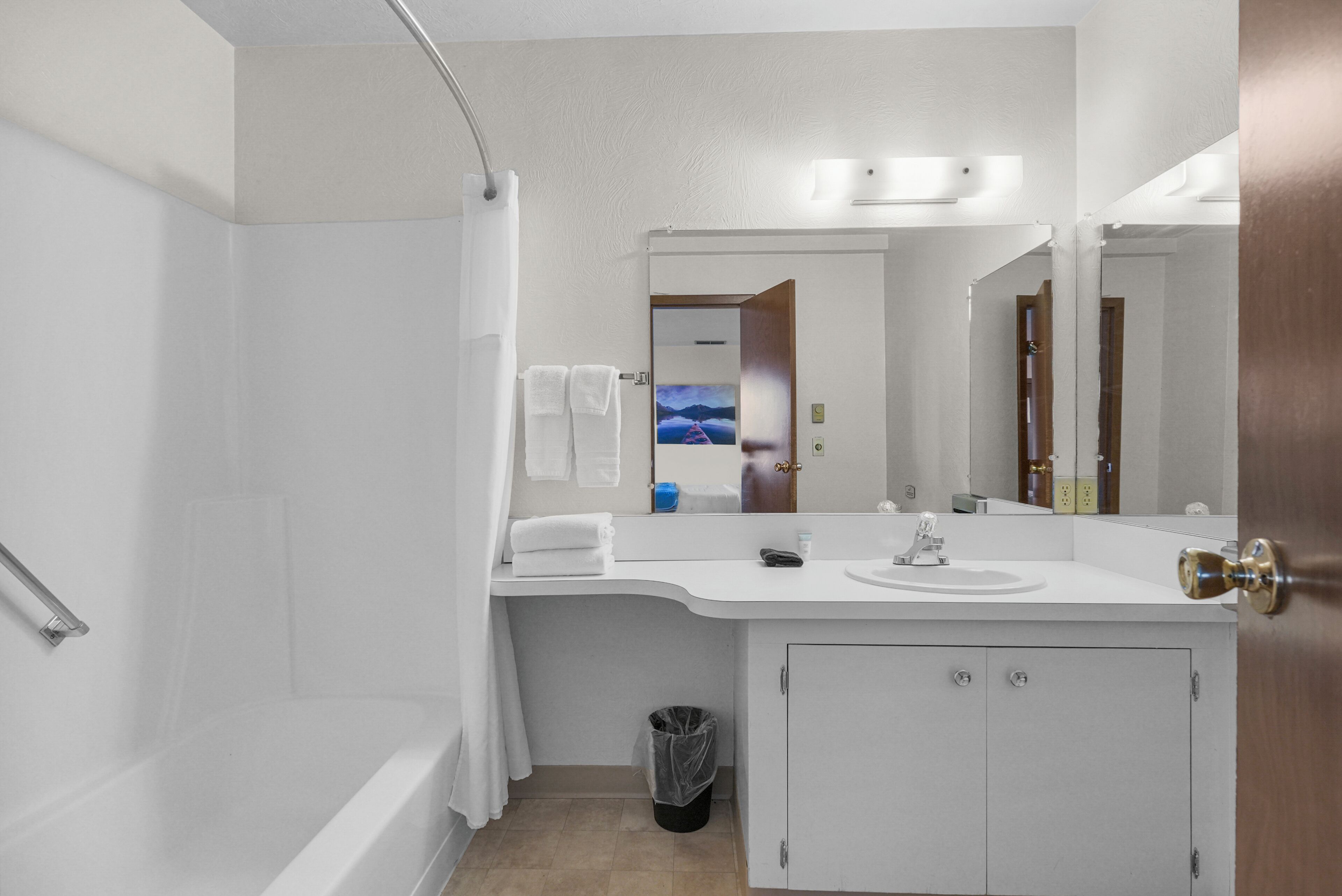 Shower, hair dryer, towels, toilet paper