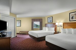 A hotel room with two beds, a television, a desk, and a window with curtains. - 4 F Units with Lazy River | Oceanview Pool Escape | 1.8 mi to Convention Center (Myrtle Beach)