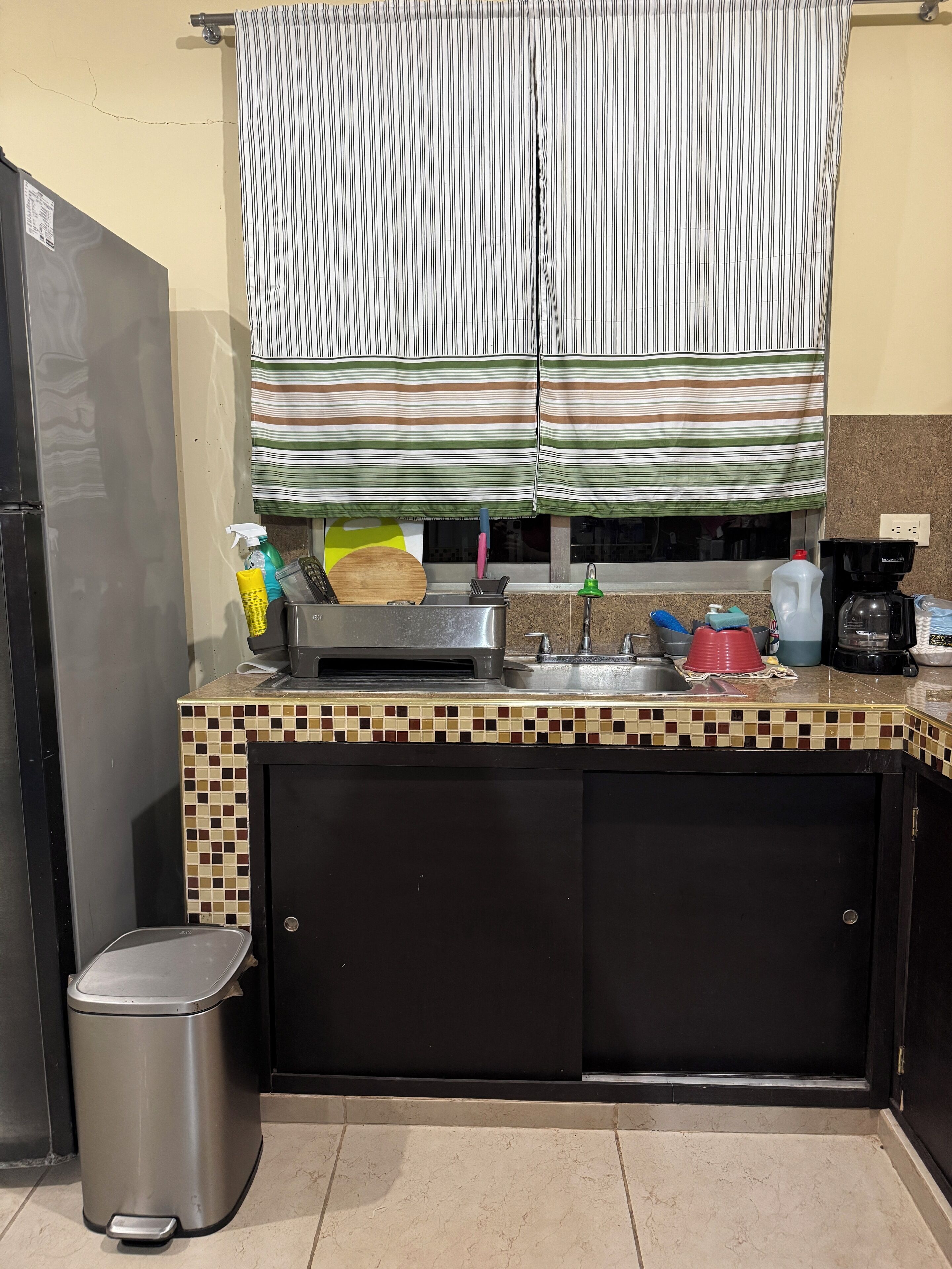 Coffee/tea maker, microwave, cookware/dishes/utensils, spices