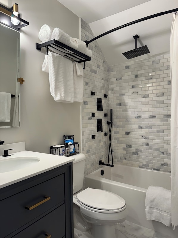 Shower, hair dryer, towels, soap