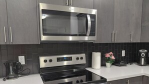 Fridge, microwave, oven, stovetop - Unwind in this serene environment with close proximity to the airport. (Calgary)