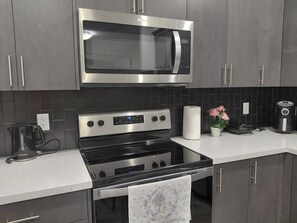 Fridge, microwave, oven, stovetop - Unwind in this serene environment with close proximity to the airport. (Calgary)