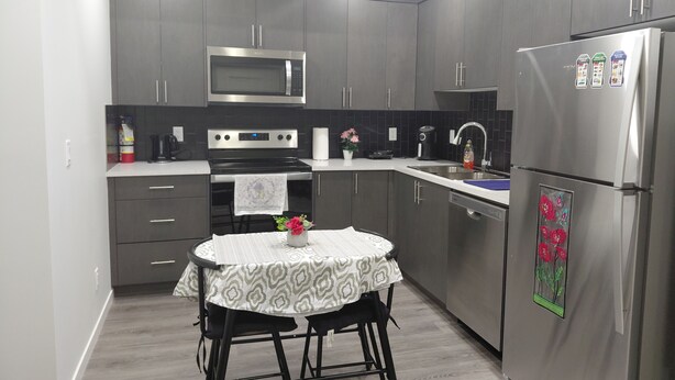 Fridge, microwave, oven, stovetop - Unwind in this serene environment with close proximity to the airport. (Calgary)