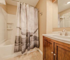 Shower, hair dryer, towels, shampoo