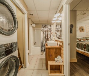 Shower, hair dryer, towels, shampoo