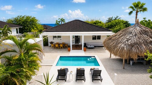 Modern 3 bedroom villa with private pool at gated Coral Estate Beach Resort