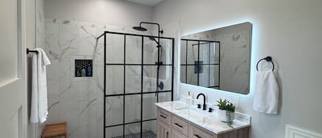 Shower, towels, soap, toilet paper