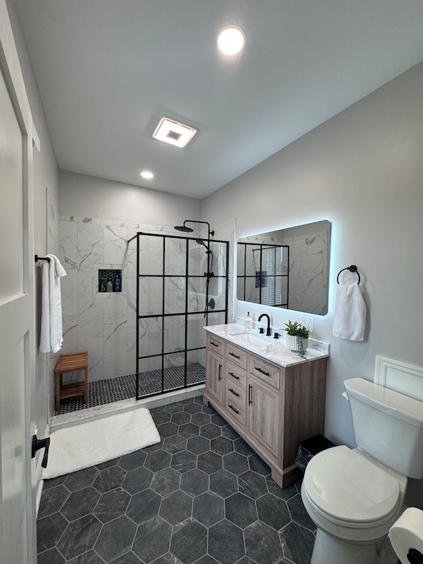 Shower, towels, soap, toilet paper
