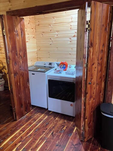 Cedar log cabin overlooking spring-fed ponds with waterfalls at Wautauga Springs