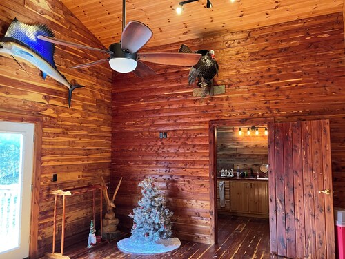 Cedar log cabin overlooking spring-fed ponds with waterfalls at Wautauga Springs